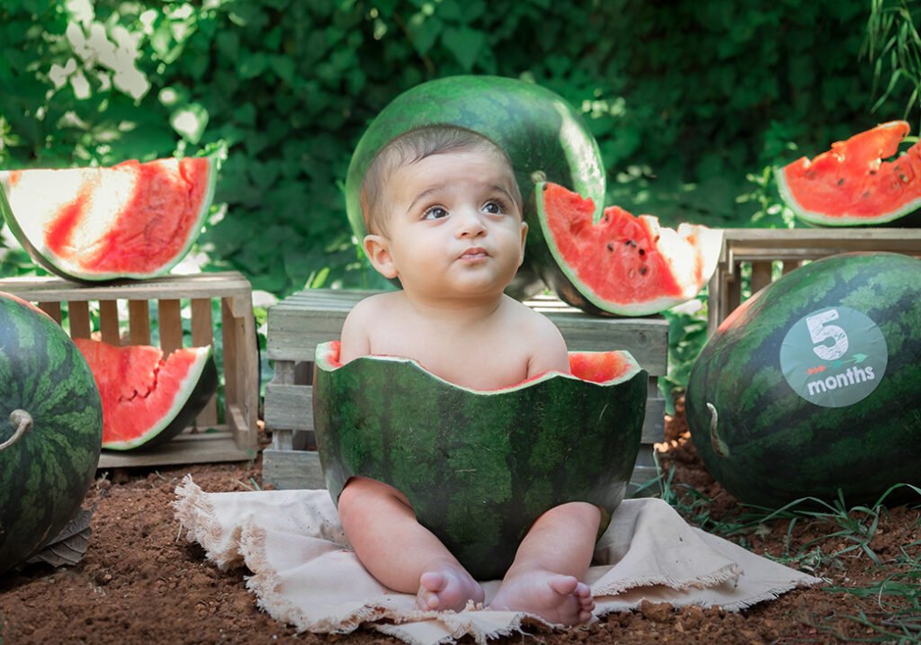 watermelon outdoor photo shoot session summer green garden 5 months old sitter