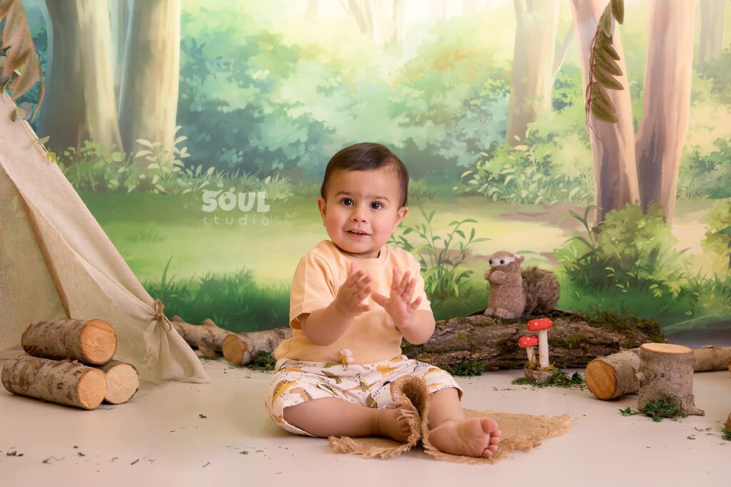 camping forest trees trunks teepee tent baby boy girl sitter squirrels mushrooms moss nature
