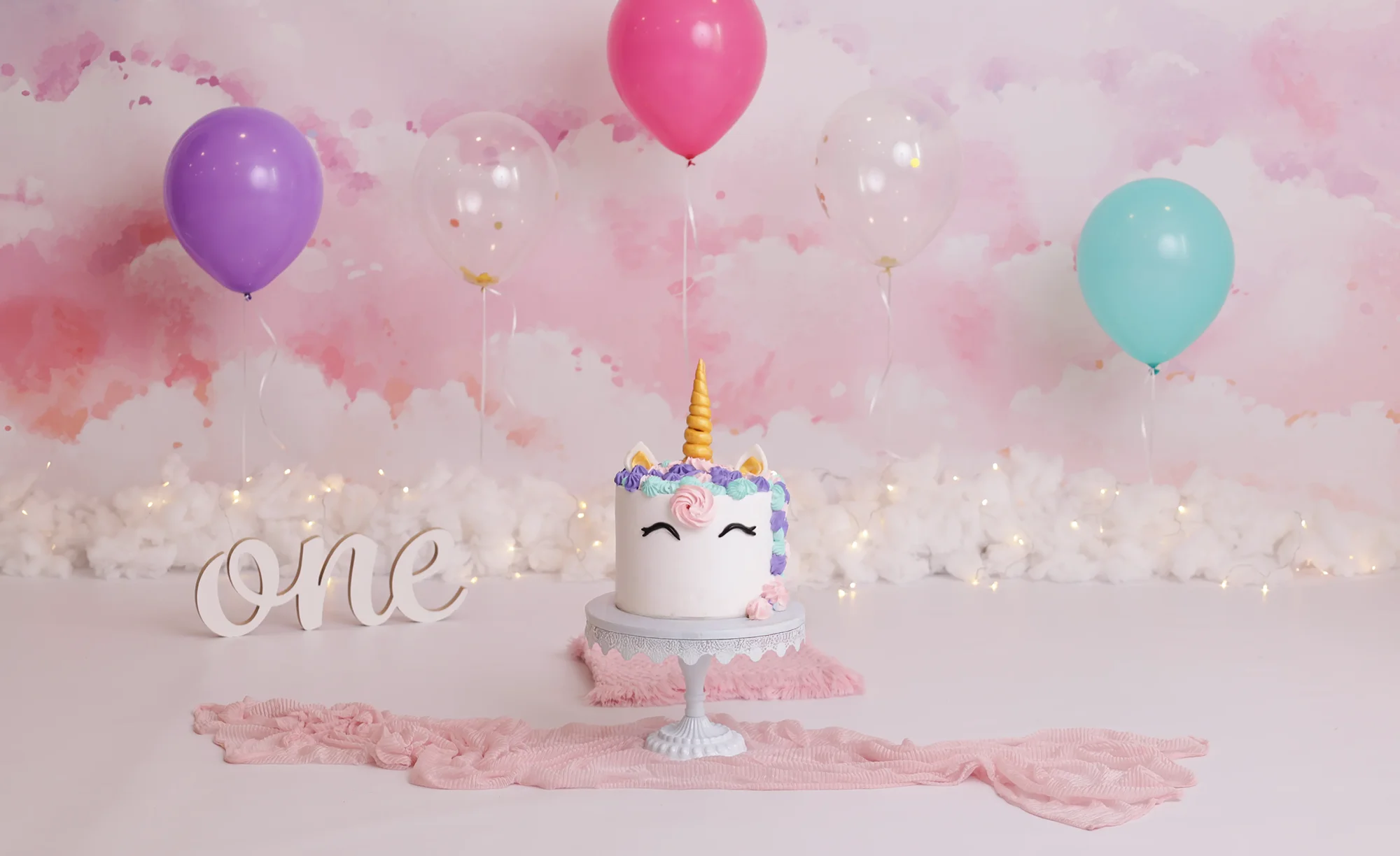 Pastel unicorn cake smash setup at Soul Studio, Amman